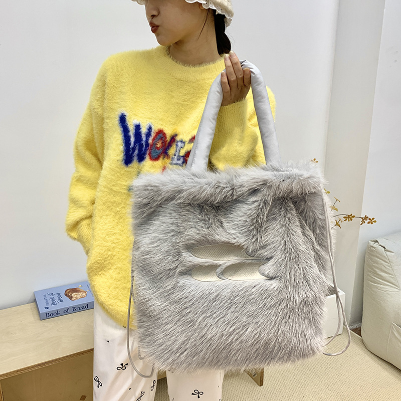 Korean trendy large-capacity 2024 winter new fluffy backpack, niche hand-held backpack, single-shoulder tote bag full figure