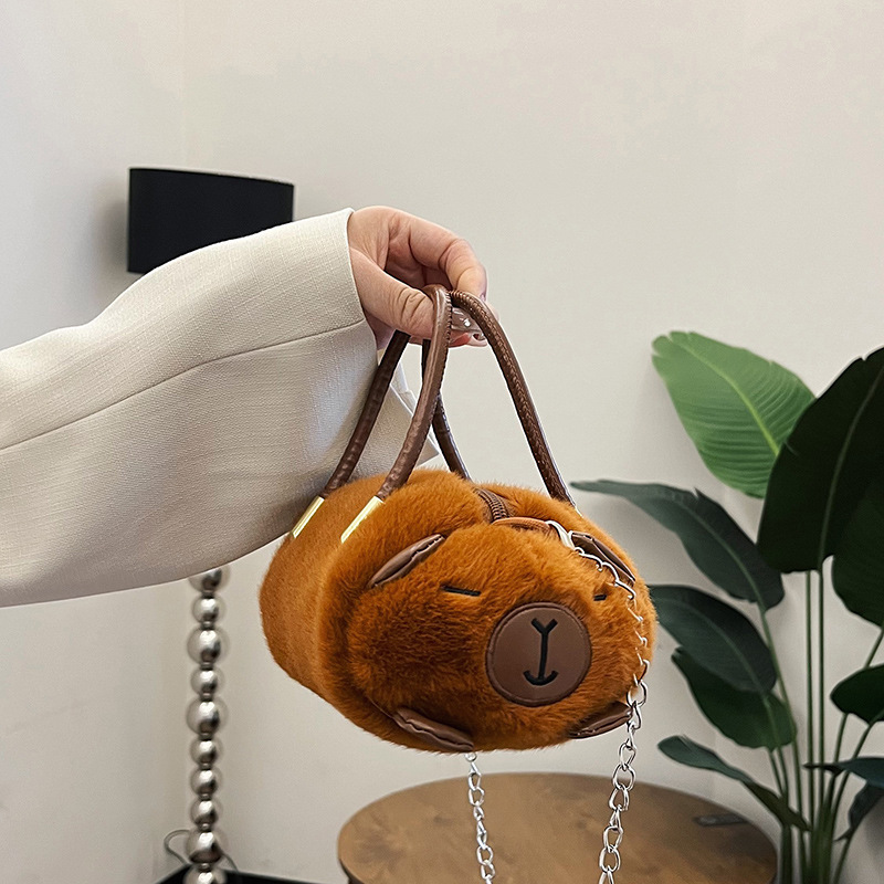New Capibara plush toy hand-held crossbody bag, fashionable capybara doll bag, claw machine doll for gift exchange details Picture