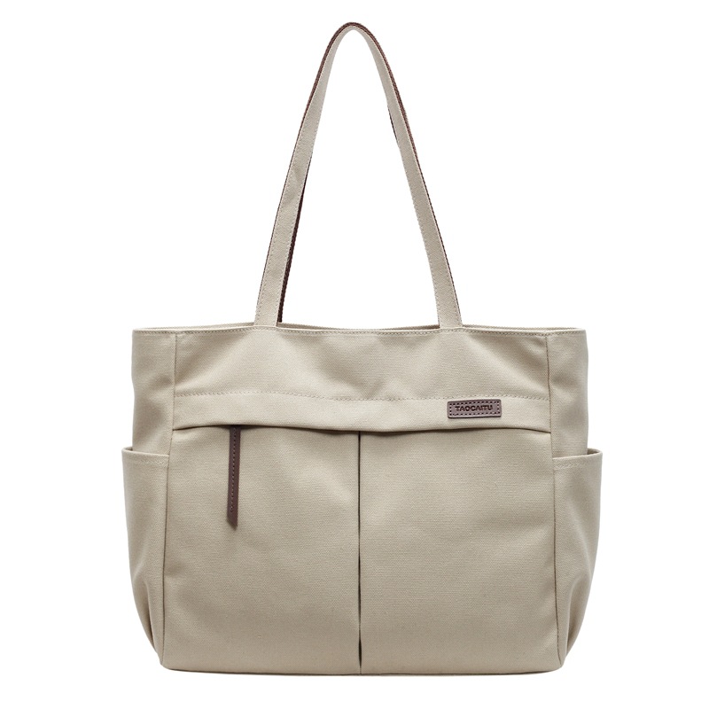 Japanese and Korean artistic and simple hand-held shoulder canvas bag for women, a new Spring/Summer 2025 trendy and versatile commuter tote bag Item Picture