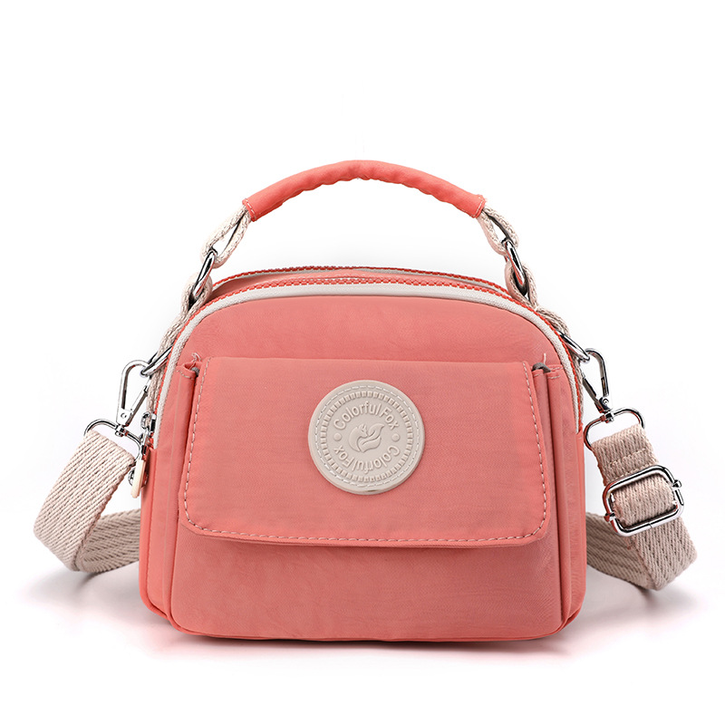 New cross-border women's fashion and trend crossbody bag, Japanese style simple water repellent bag, lipstick, loose change portable handbag Item Picture