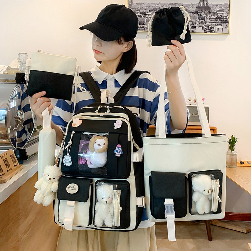 Korean style cute and versatile color-blocked canvas backpacks, 2022 new campus style color-blocking primary school students wholesale full figure