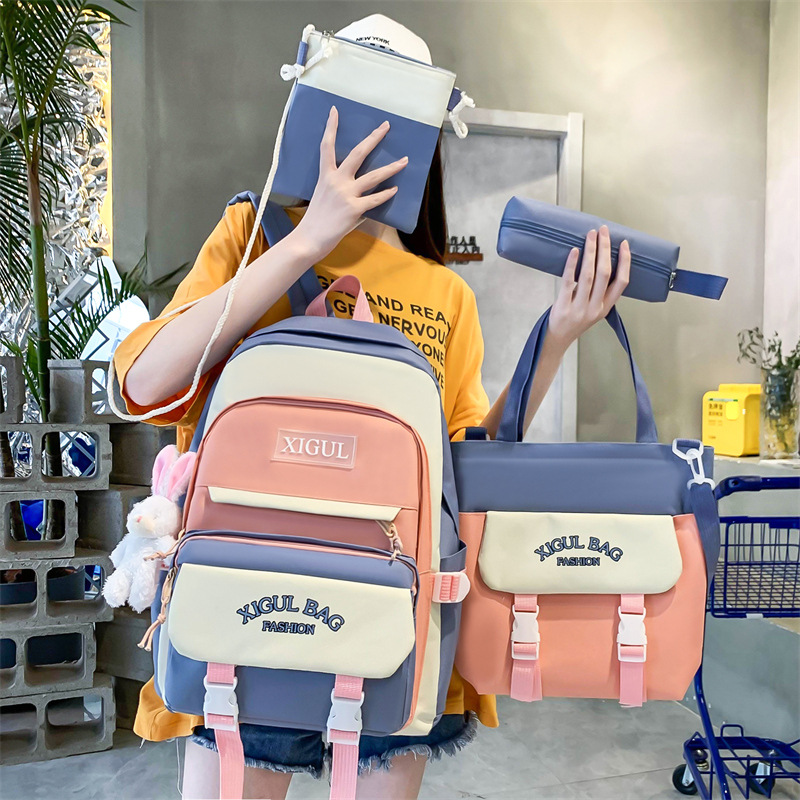 A large-capacity schoolbag for junior and senior high school students, a fashionable color-blocking Korean-style backpack with high appearance standards, a four-piece set of girls' tutorial bags full figure
