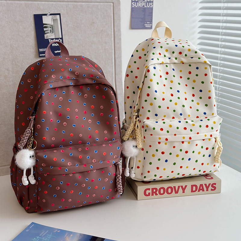 Cute and soft polka dot schoolbag, new high school, junior high school and college students' backpack, travel lightweight and load-reducing backpack full figure