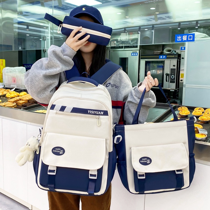 The Korean version of the Instagram large-capacity backpack for junior and senior high school students is a trendy four-piece set with contrasting colors full figure
