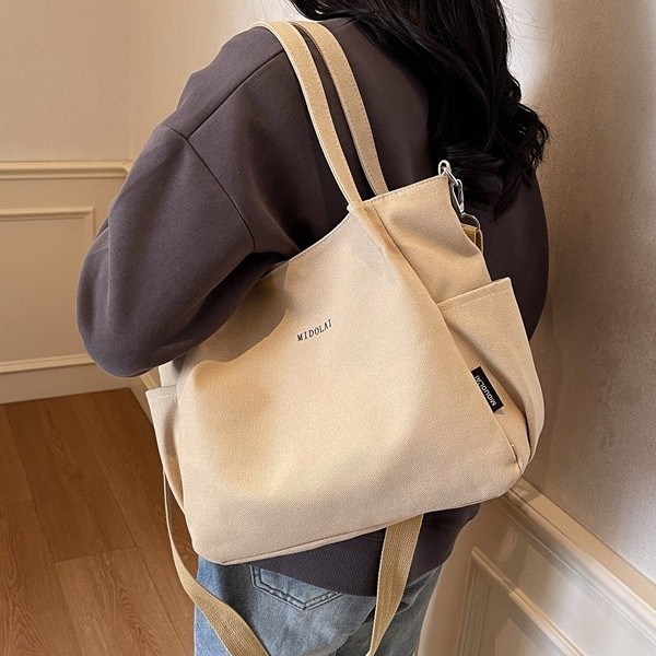 Korean large-capacity canvas bag, multi-pocket tote bag, fashionable commuting crossbody bag, solid-color casual single-shoulder bag full figure