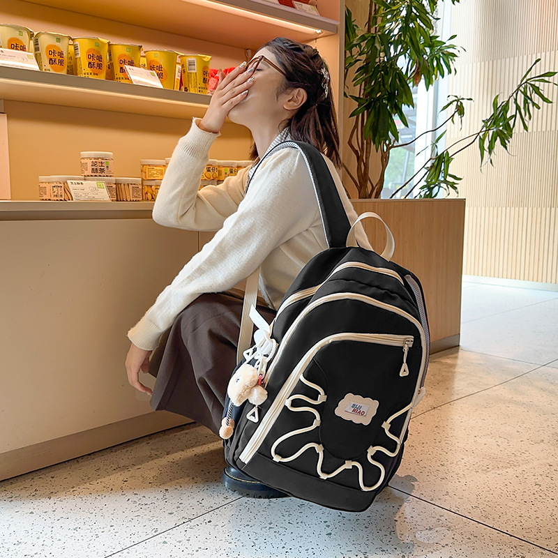 This high-appearance-level ins style large-capacity backpack is lightweight and has a niche design sense. It is a multi-layered backpack for junior and senior high school students details Picture