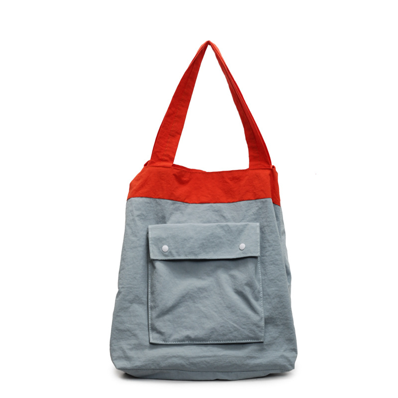 A large-capacity fabric cotton-padded jacket bag for women, a new 2025 trendy, simple and color-blocking casual commuting single-shoulder tote bag Item Picture