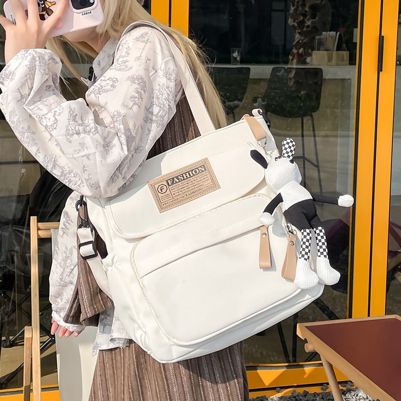 Schoolbag for female middle school students, large-capacity bag for male high school students, trendy single-shoulder bag, tutorial bag, Korean style versatile single-shoulder handbag details Picture
