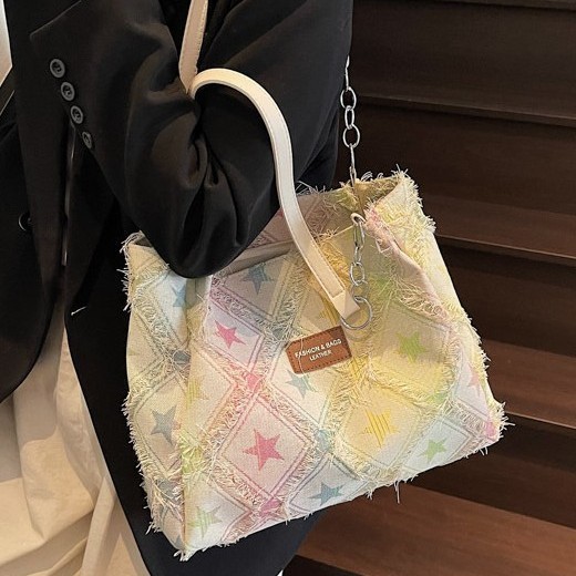 This is a stylish and trendy denim tote bag with a star-patterned design. It features a large-capacity, casual and fashionable single-shoulder bag Application Scenario