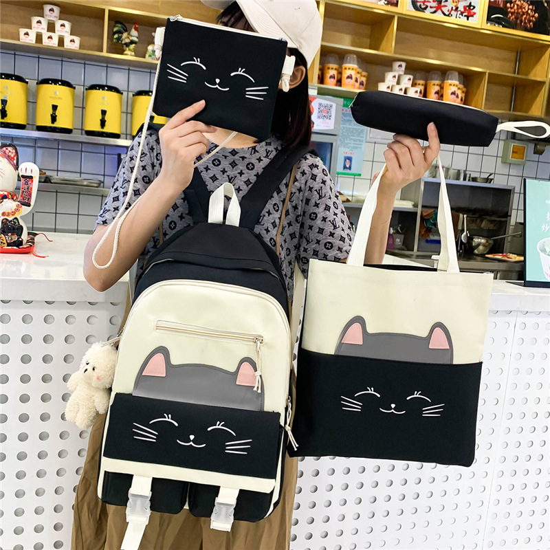 A new Korean-style schoolbag for girls, featuring cute cartoon cats, is a four-piece backpack set for grades three to six details Picture