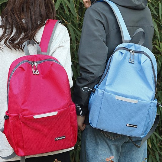 A new fashionable, lightweight and foldable couple backpack with a large capacity of nylon fabric for portable travel Application Scenario