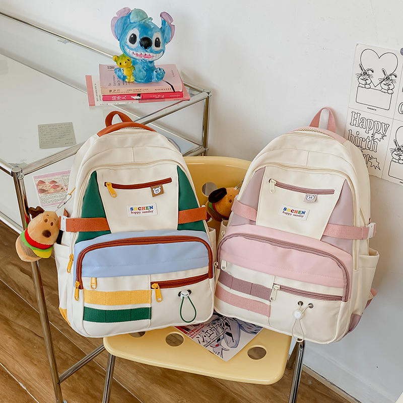 High-appearance-level schoolbag for female college and high school students, cute color-blocking backpack, niche design sense, funny girl backpack full figure