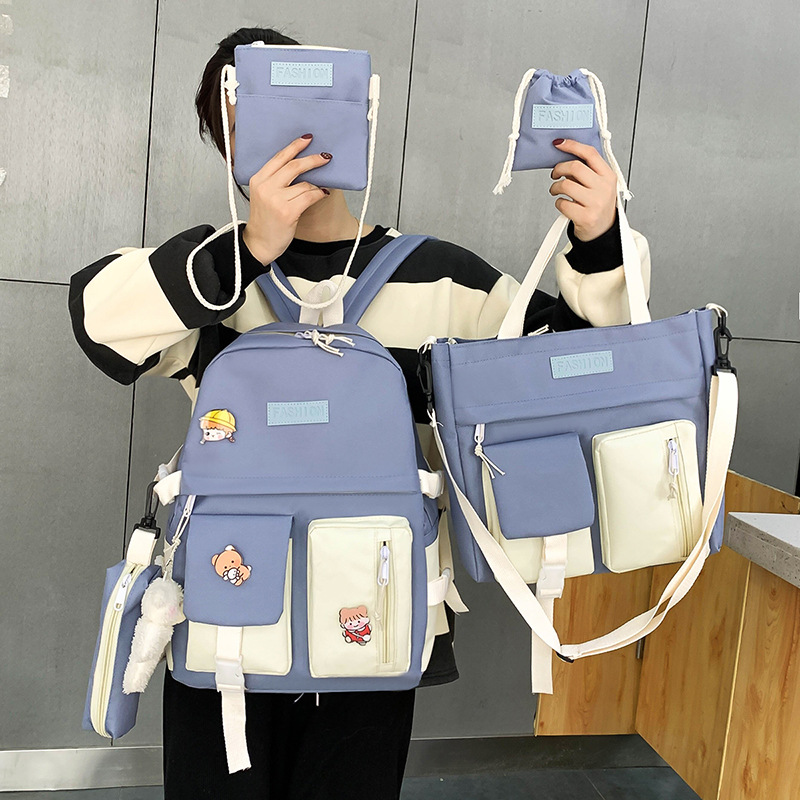 A new Korean-style canvas five-piece backpack for girls, a hand-held schoolbag for grade 34, 56 primary school students full figure