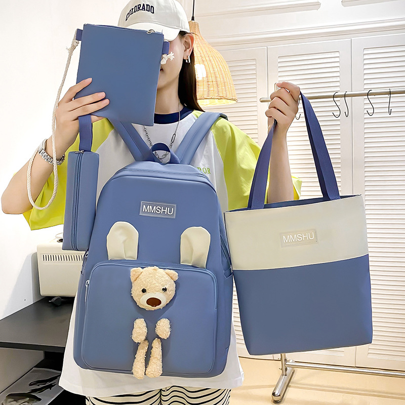 A cute cartoon bear backpack set of four pieces, a large-capacity hand-held after-school bag for primary school students, a casual and versatile trendy backpack details Picture
