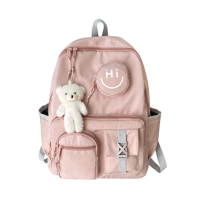 Smiley face fashionable backpack, schoolbag for primary and middle school students, toy pendant bag, cute campus leisure, burden relief for girls Item Picture