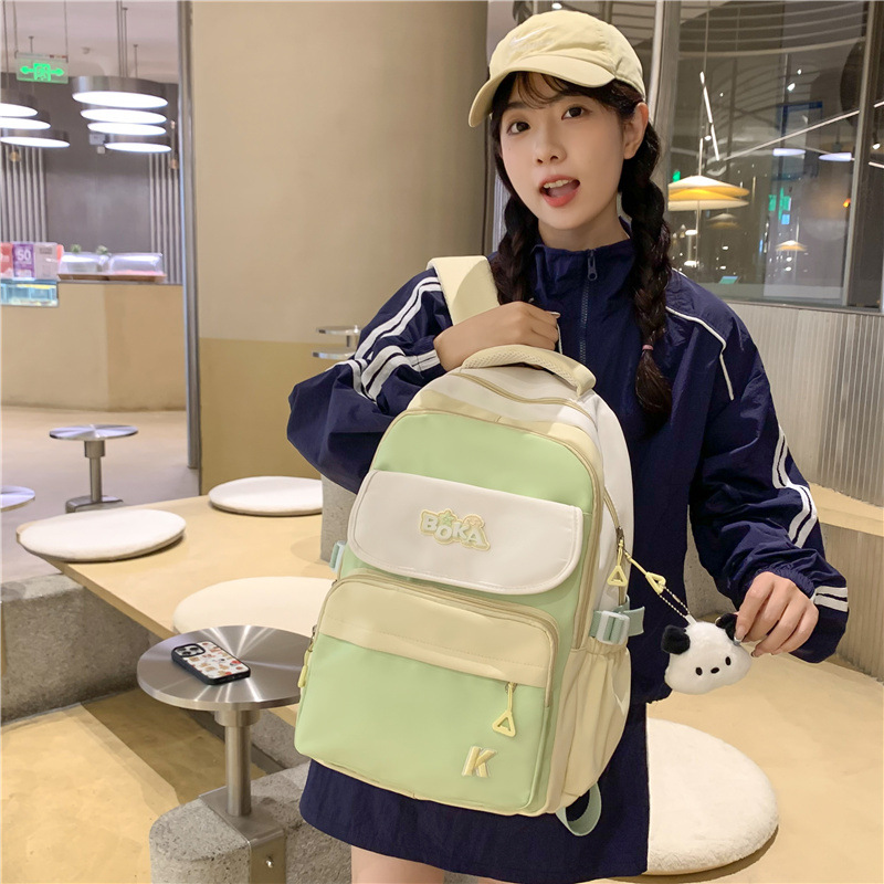 A large-capacity, multi-compartment, lightweight and simple backpack for female college students, a travel computer backpack for junior high school and senior high school students full figure