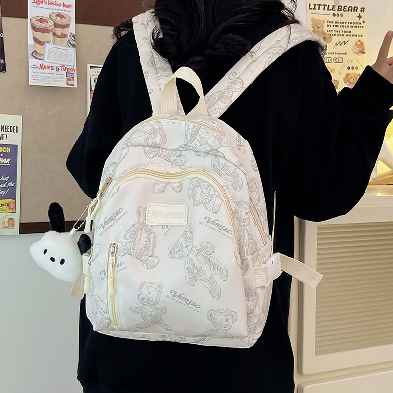 New cross-border children's schoolbags with cartoon bear prints, boys' and girls' backpacks, travel backpacks, and lightweight back-protecting schoolbags full figure