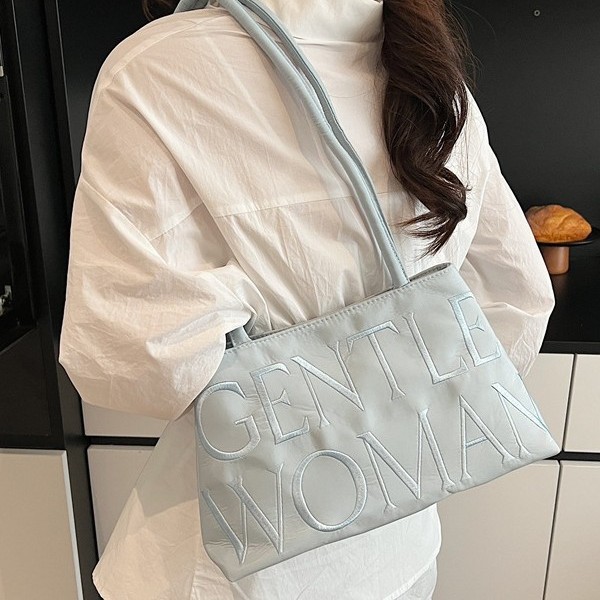 The 2025 new satin letter embroidery thread single-shoulder bag features a niche design that is fashionable and versatile. It is a single-shoulder hand-held underarm bag with tote full figure