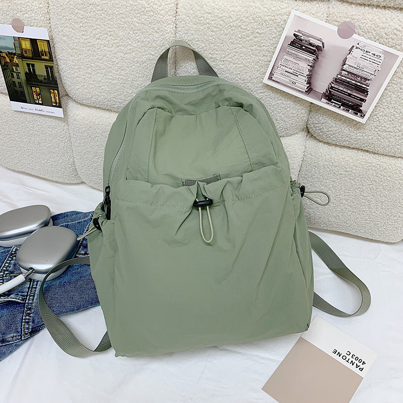 A new outdoor backpack in a trendy Korean style, with a unique pleated design, is casual and stylish, waterproof and has a large capacity. It is a lightweight backpack for college students Application Scenario