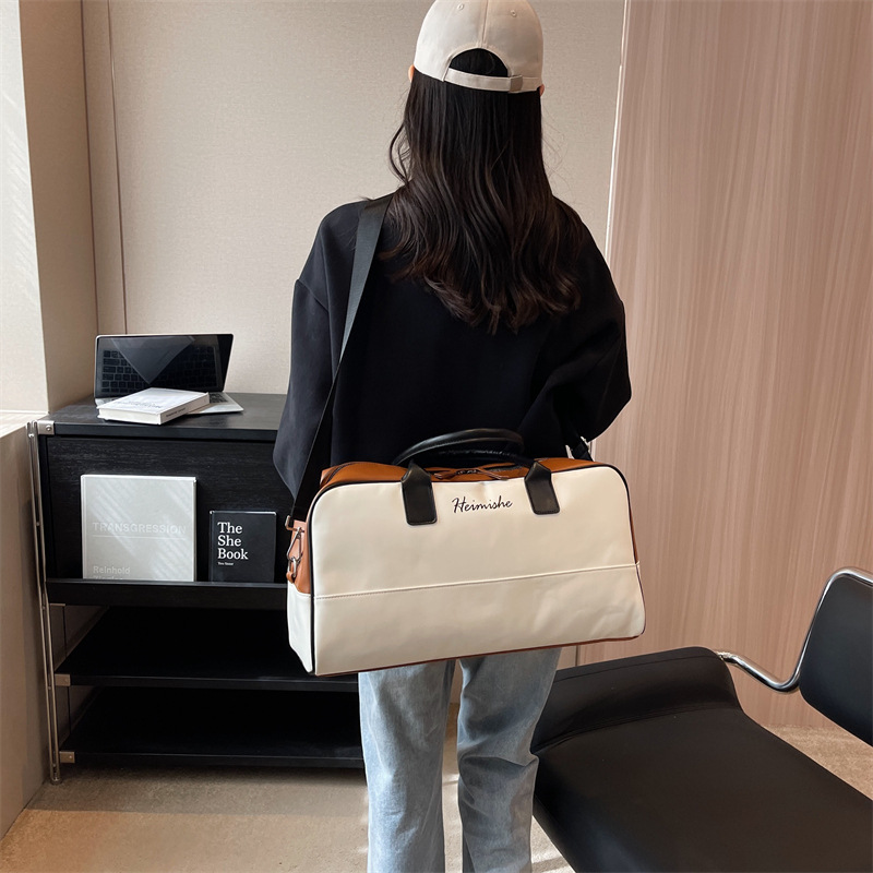 New large-capacity luggage bag for short business trips, fashionable color-blocking travel bag, simple hand-held shoulder bag for clothing storage full figure