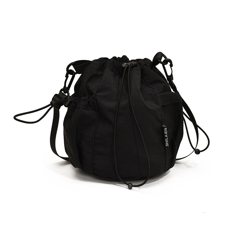 New versatile retro single-shoulder bag, lightweight design, large-capacity bucket bag, niche fashion drawstring writing crossbody bag Item Picture