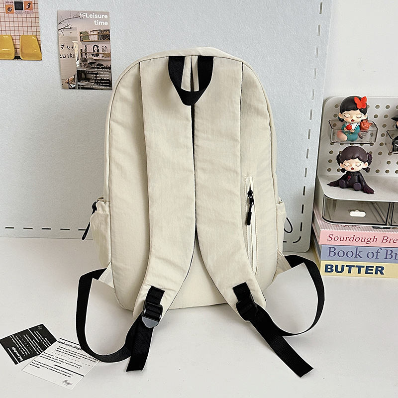 A lightweight college student backpack from a trendy Japanese Instagram brand, with a high level of appearance, simple and solid color design, and a versatile computer backpack Specification drawing