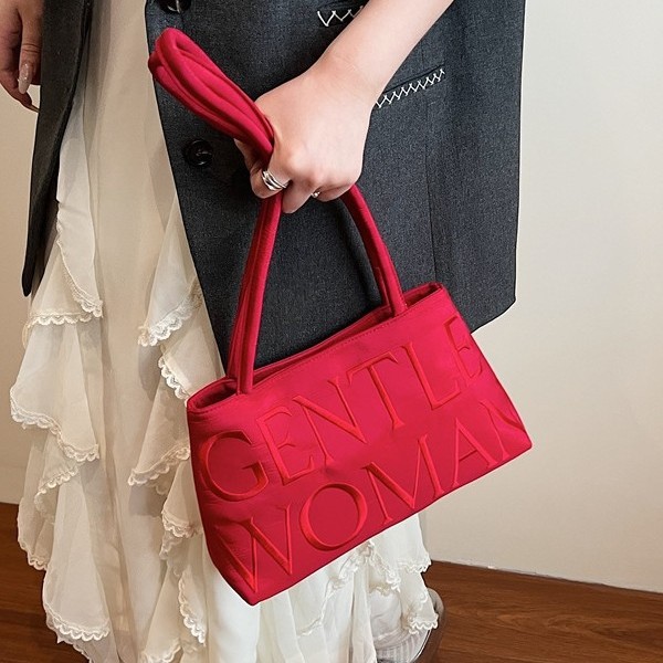 The 2025 new satin letter embroidery thread single-shoulder bag features a niche design that is fashionable and versatile. It is a single-shoulder hand-held underarm bag with tote details Picture
