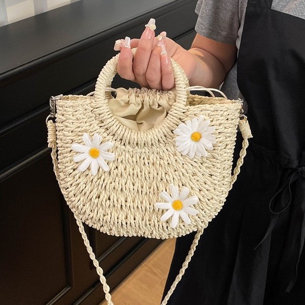 The new hand-held InS-style straw woven bag, the moon bag, the simple and fashionable Daisy woven women's bag, and the fresh bag details Picture