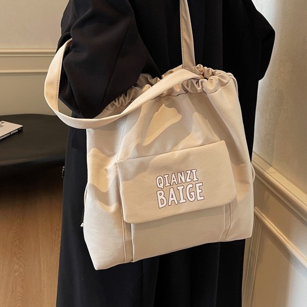 New women's 2024 large-capacity single-shoulder bag, a trendy brand fashion drawstring pocket, solid color casual shopping bag full figure