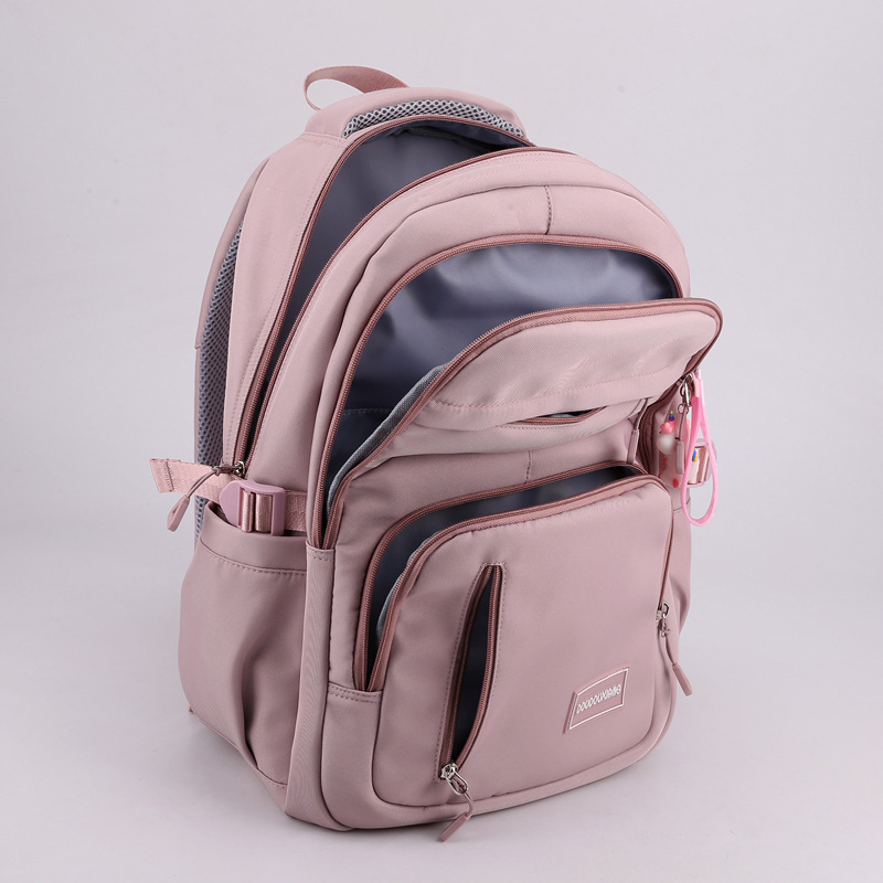 A new large-capacity schoolbag for junior and senior high school students, a high-end solid-color casual backpack for women, and a multi-layered travel bag trend Application Scenario