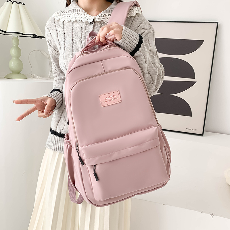 New 2025 student backpack, Korean style, simple and trendy bestseller, high appearance level, large capacity commuting schoolbag full figure