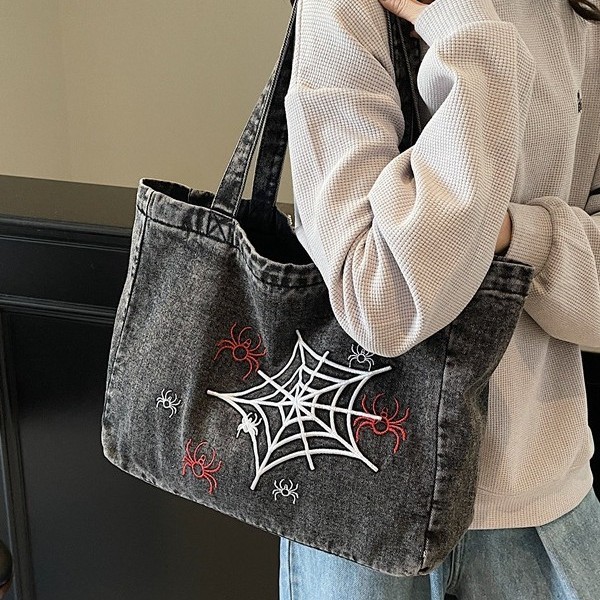 A versatile Instagram Korean denim tote bag for women 2025, featuring a large capacity single-shoulder bag with embroidered design for commuting Application Scenario