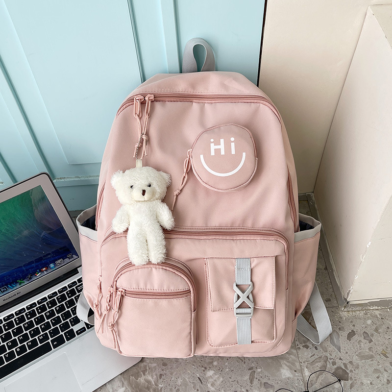 Smiley face fashionable backpack, schoolbag for primary and middle school students, toy pendant bag, cute campus leisure, burden relief for girls Application Scenario