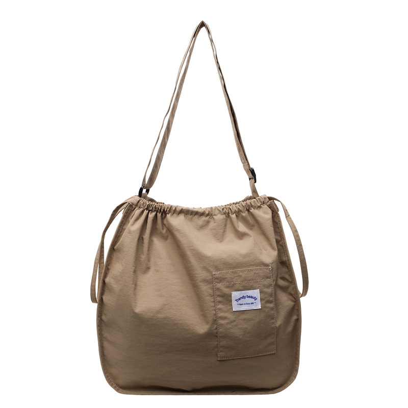 The 2025 new lightweight handbag is a small and exquisite cloth bag with a solid color and simple drawstring. It is a student portable single-shoulder bag Item Picture