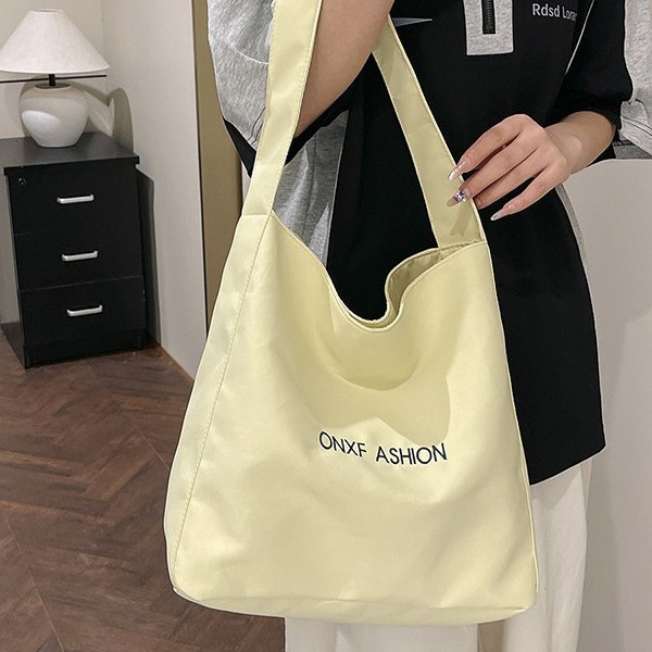 The 2025 new shiny nylon tote bag is a niche, large-capacity, simple and casual daily backpack with a fresh and clean look details Picture