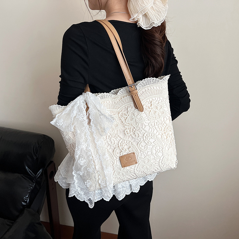 Korean lace bow large-capacity tote bag for women 2025 new style, hollowed-out, versatile and simple single-shoulder armpit bag full figure