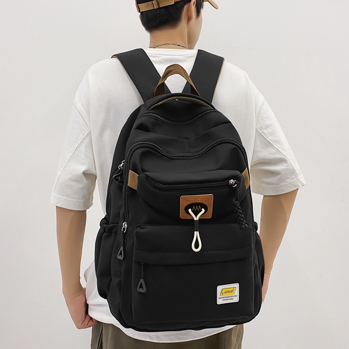 Trendy brand backpacks for men in 2024, large-capacity travel backpacks for junior and senior high school students, and computer backpacks for female college students full figure