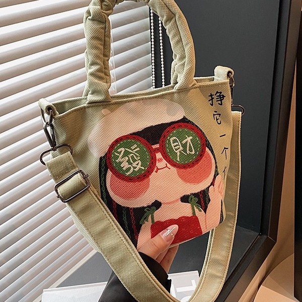 The popular cartoon graffiti bucket bag for autumn and winter 2024 is a cute new fashionable handbag and a versatile cartoon shoulder bag details Picture