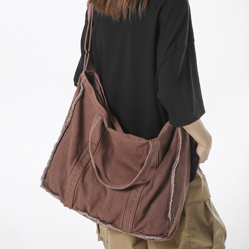 Japanese single-shoulder bags for men and women, 2024 new style, with unique fringed canvas bags, hand-held crossbody bags, and ins student messenger bags full figure