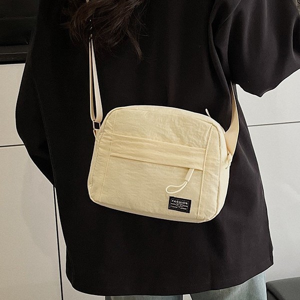 A versatile nylon fabric bag for cross-border use between Japan and South Korea, a solid color multi-functional single-shoulder bag for commuting and work, a cosmetic bag, and a crossbody bag Application Scenario