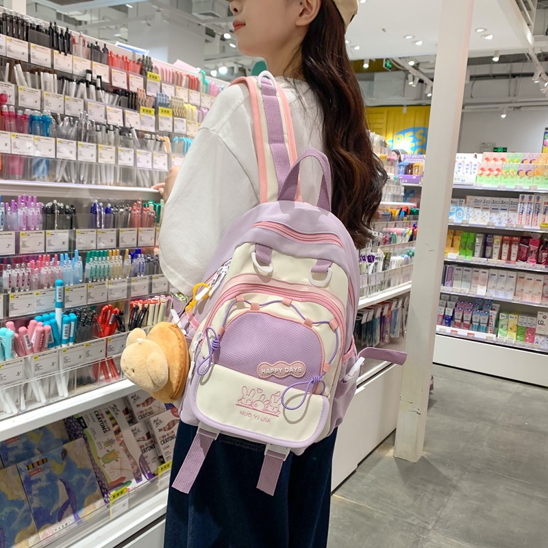 The new 2025 schoolbag with a school style and contrasting colors is a lightweight and mini backpack. It's a cute and fresh girl's backpack details Picture
