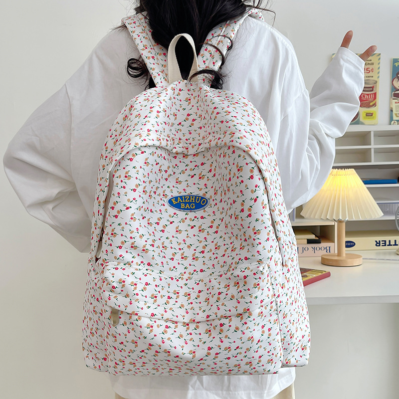 Cross-border, fresh, artistic, retro, Japanese-style, simple and casual student backpack, cute and lightweight, small flower schoolbag Application Scenario