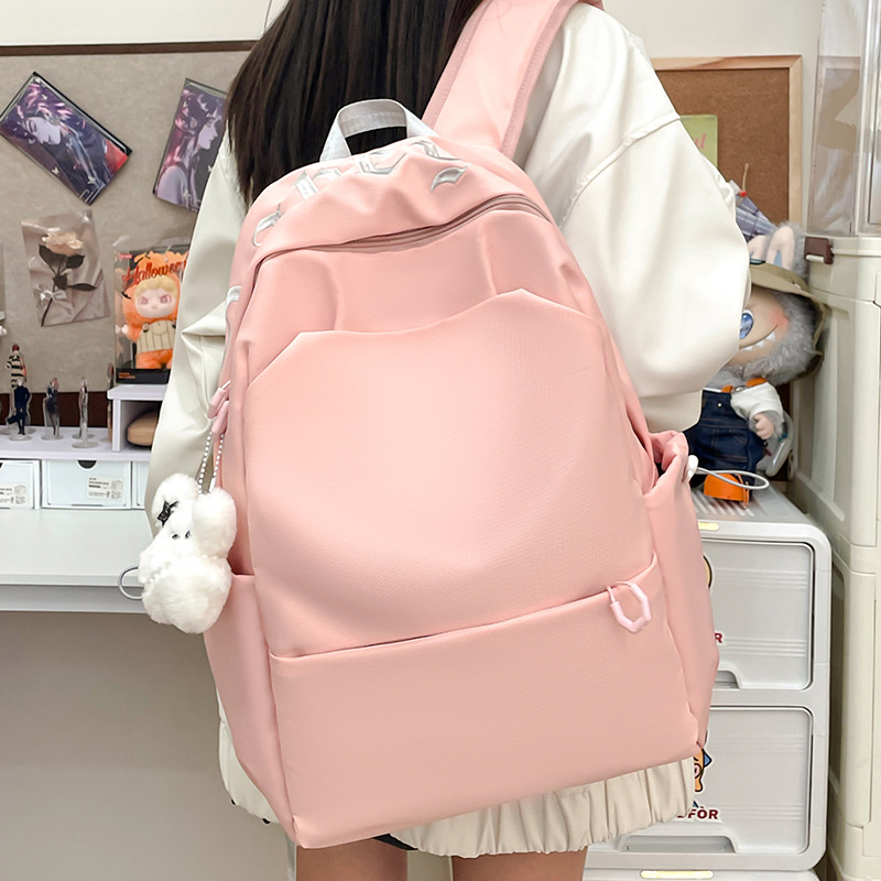 Forest-style high-appearance-level female college student backpack, simple solid color large-capacity travel backpack for both men and women, 2025 new style details Picture