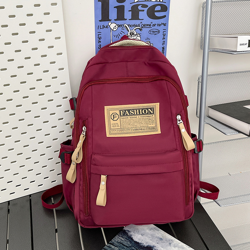 New Korean version 2025 schoolbag for junior high school students, simple and fashionable, large-capacity female backpack for college students full figure
