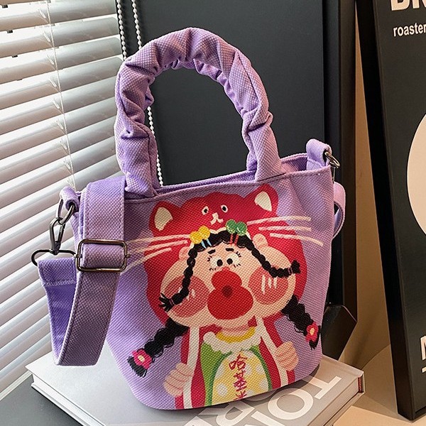 The popular cartoon graffiti bucket bag for autumn and winter 2024 is a cute new fashionable handbag and a versatile cartoon shoulder bag full figure