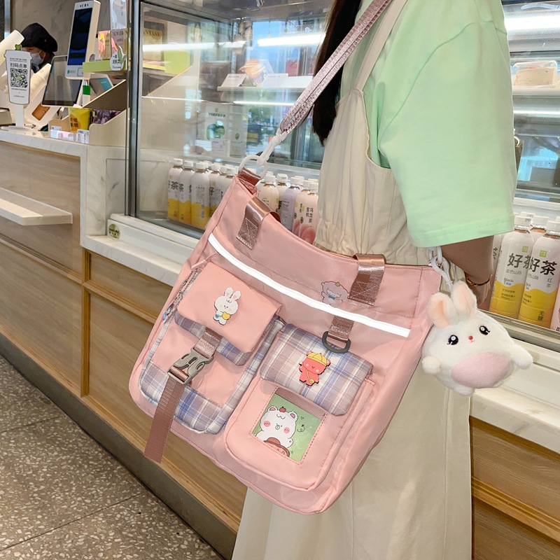 ins windsail cloth bag, girls' crossbody bag, large capacity, cute, primary school students' hand-held book bag for class make-up, single-shoulder bag details Picture