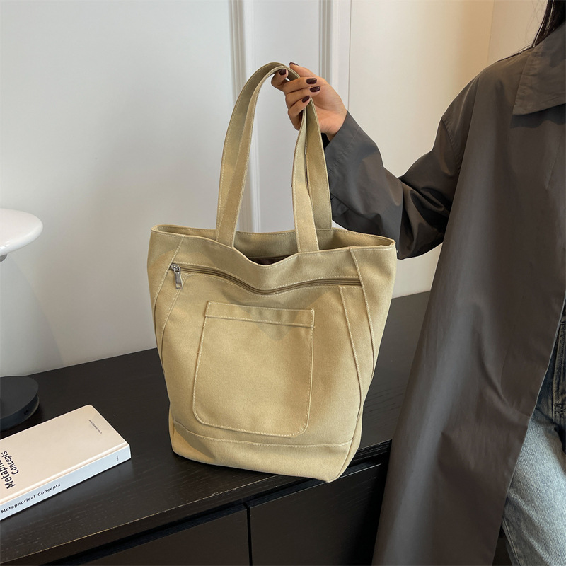 New canvas bag, simple and casual solid color women's bag 2025, large-capacity tote bag, campus student make-up class bag full figure