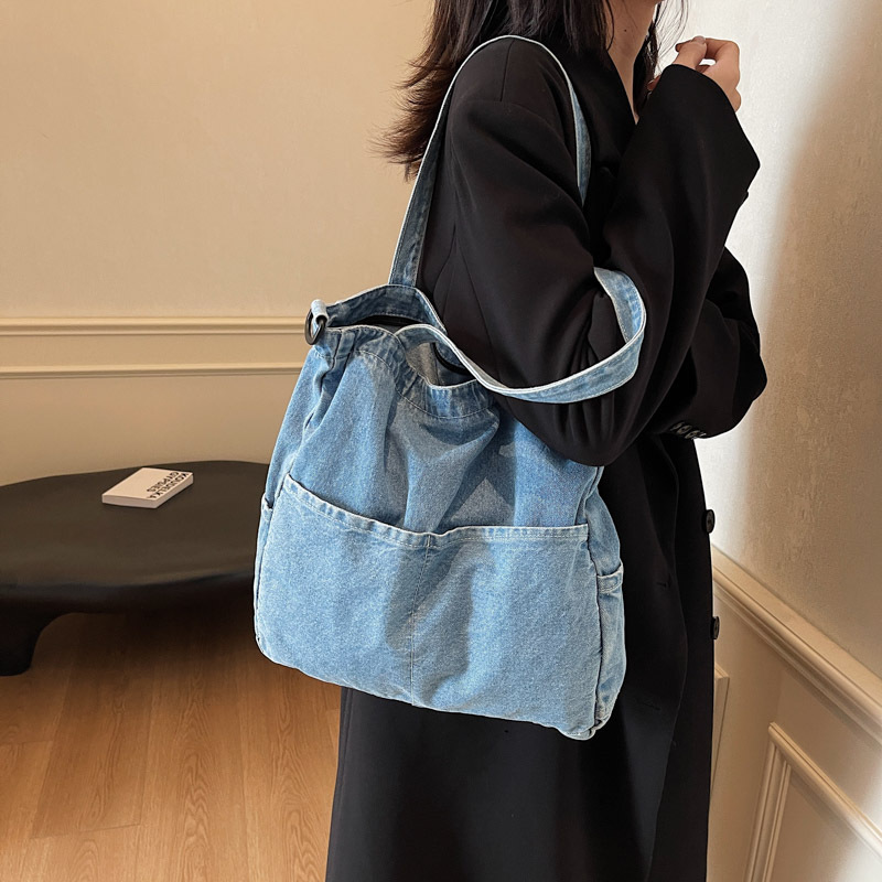 The 2024 new Tote bag for women is a casual denim, simple and elegant Korean-style single-shoulder bag with a large capacity for commuting to school full figure