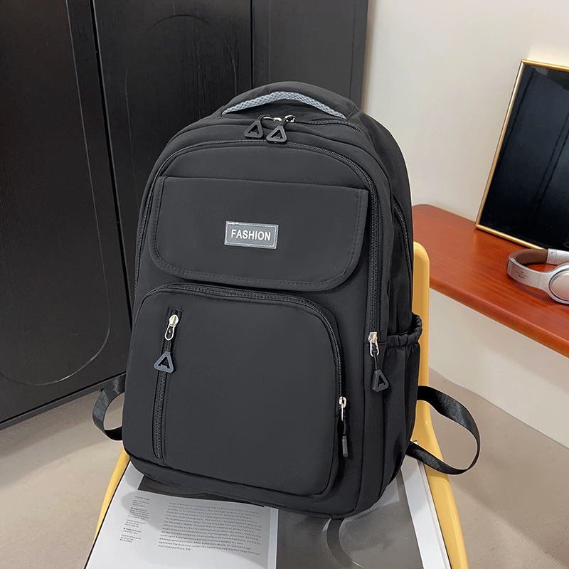 Wholesale solid color, simple and large-capacity campus-style backpacks for college and junior high school students to reduce the burden of backpacks Application Scenario