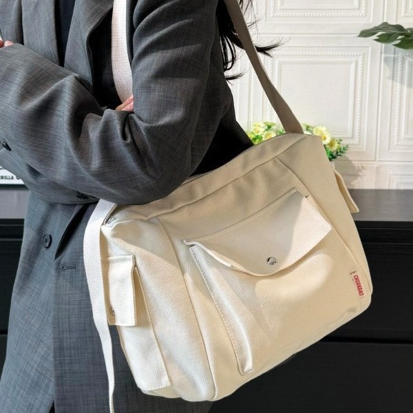 Single-shoulder bag for men, simple Japanese canvas bag, 2025 new style Korean crossbody bag, student backpack, casual messenger bag for women full figure